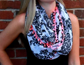 Black and White Crest Scarf with Pink PomPoms