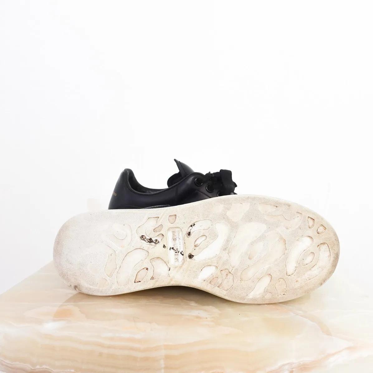 Leather exaggerated-sole sneakers RRP £460