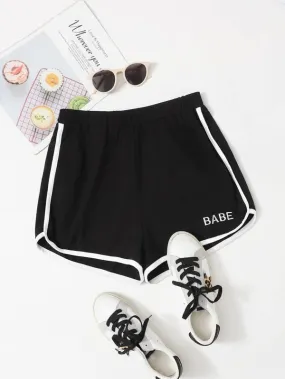 Letter Embroidered Contrast Binding Dolphin Shorts