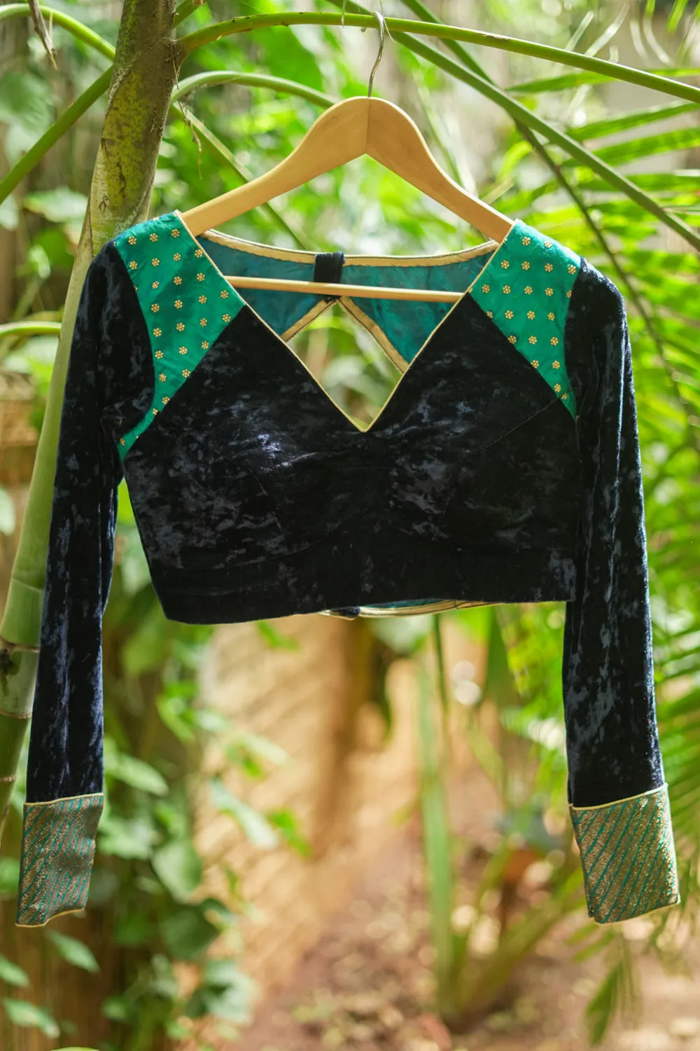 Navy blue crushed velvet V neck blouse with raw silk and brocade detailing