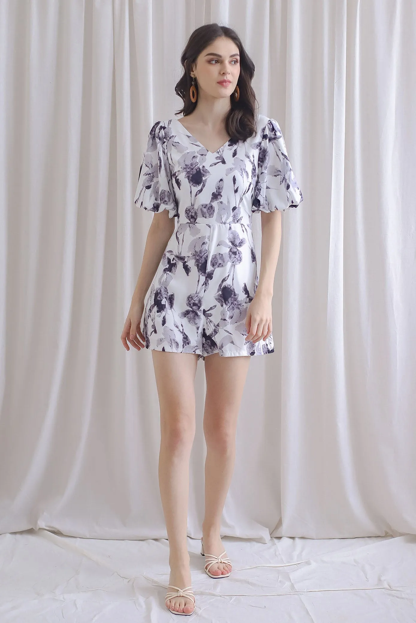 Poppie Puffy Sleeve Bow Back Romper In Mono Floral