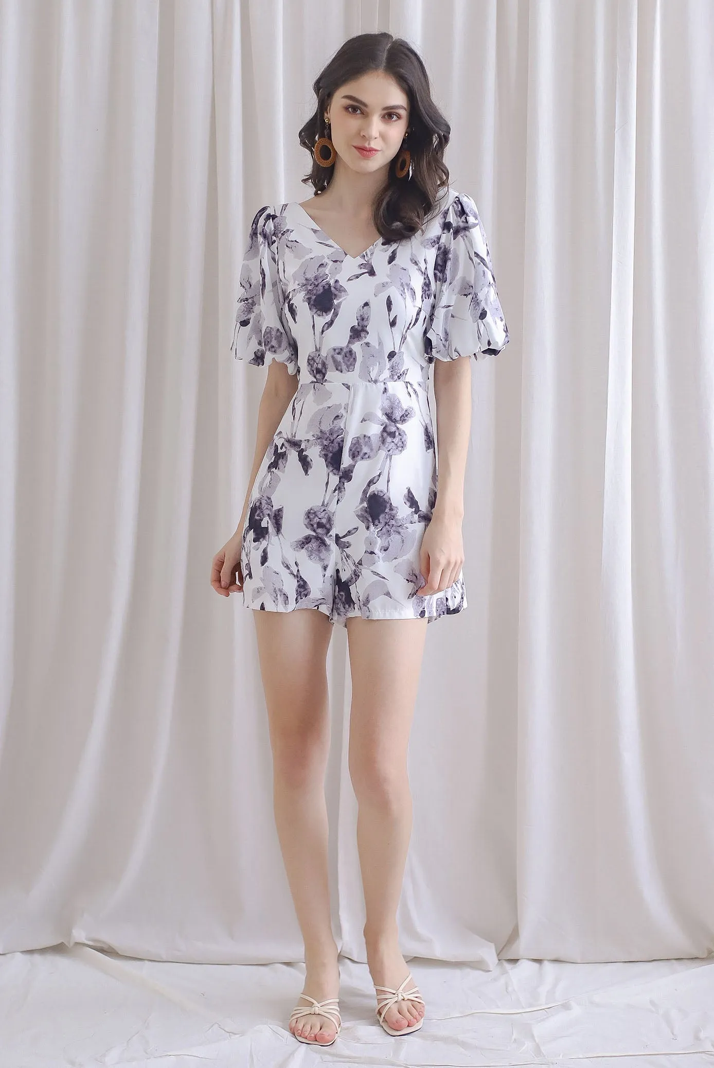 Poppie Puffy Sleeve Bow Back Romper In Mono Floral