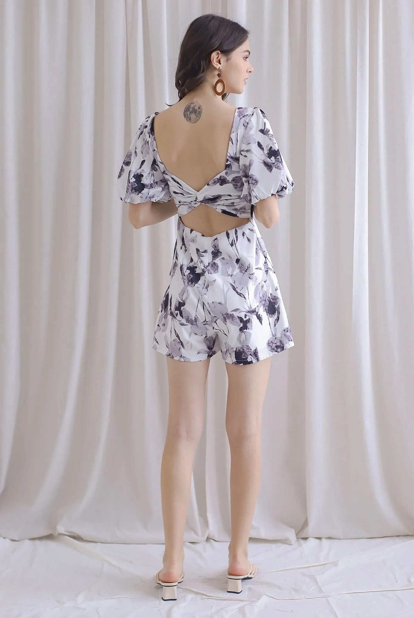 Poppie Puffy Sleeve Bow Back Romper In Mono Floral