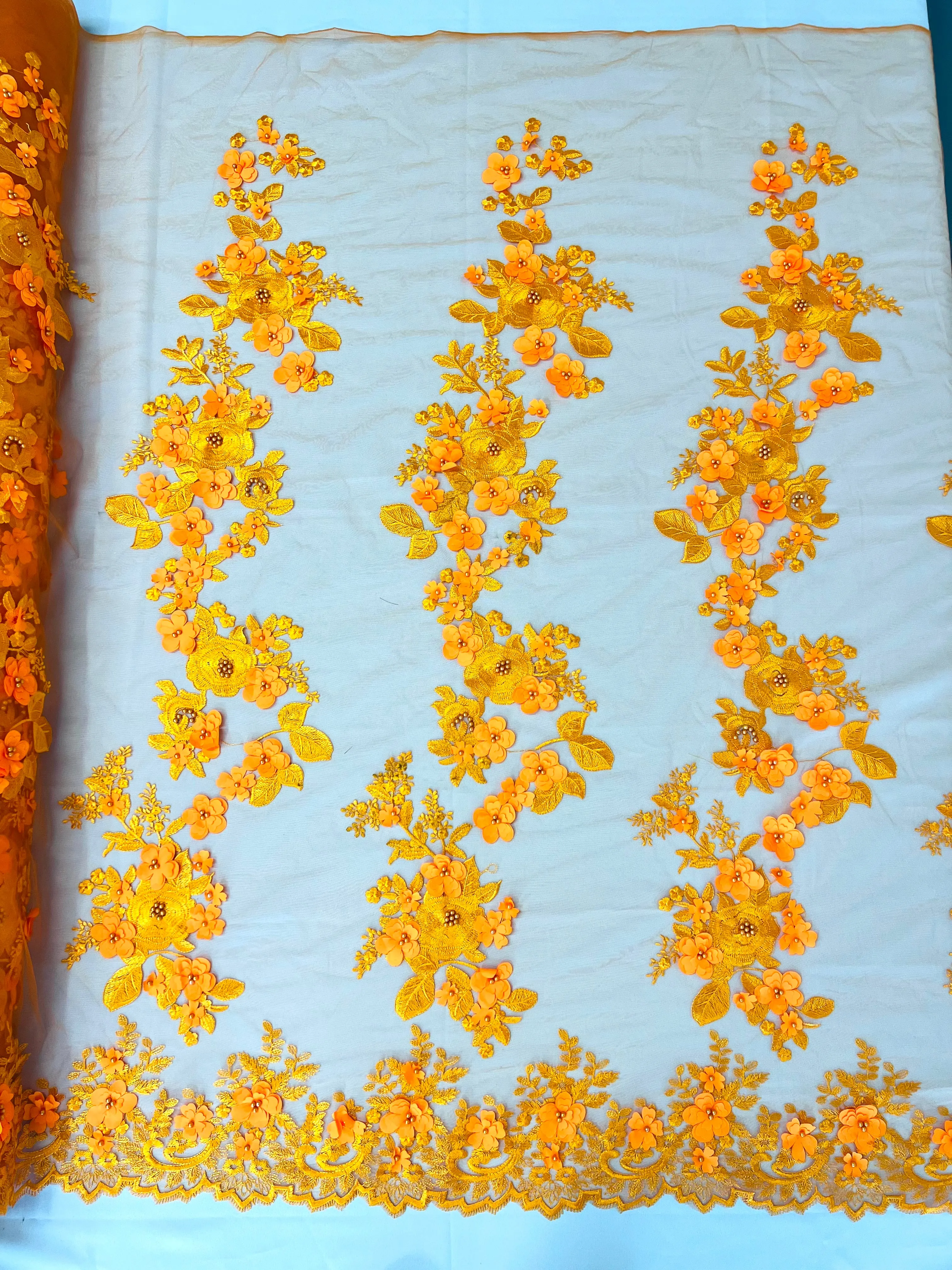 Scarlet 3d floral design embroider with pearls in a mesh lace-sold by the yard.